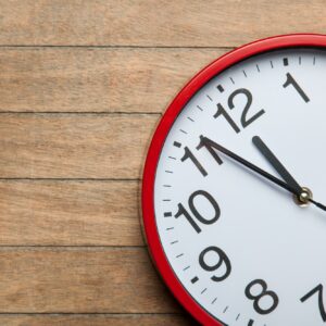 Huge clock on a table.